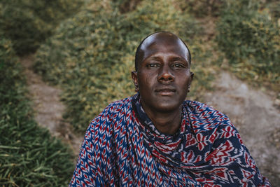 Portrait of young man standing on land