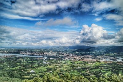 Scenic view of landscape against cloudy sky