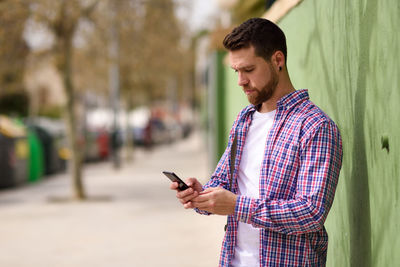 Young man using mobile phone