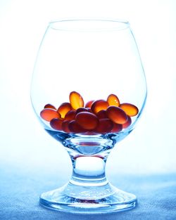 Close-up of wine glass against white background