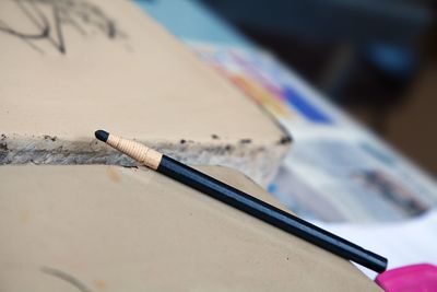 High angle view of cigarette on table