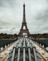 View of eiffel tower against cloudy sky