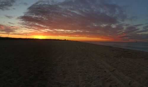 Scenic view of landscape at sunset