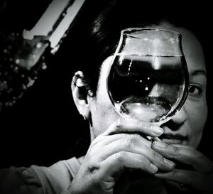 Close-up portrait of man holding beer glass