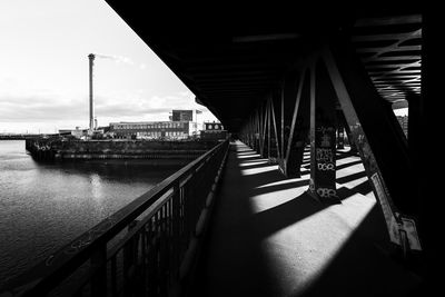View of bridge in city against sky