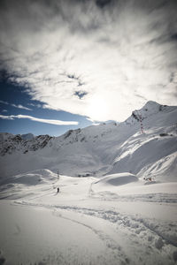Scenic view of landscape against sky during winter