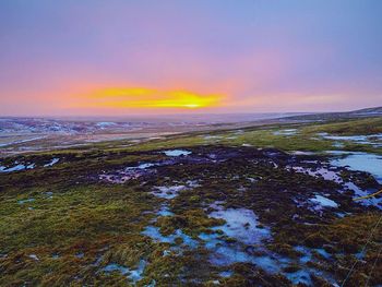 Scenic view of landscape at sunset