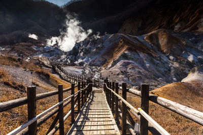 Footbridge leading towards mountains