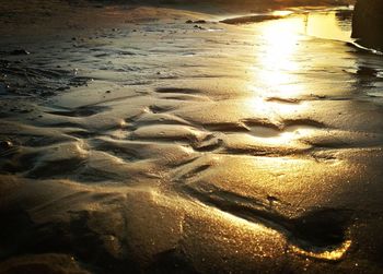 High angle view of wet beach during sunset