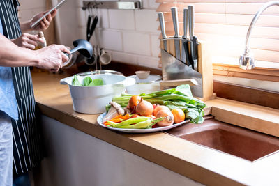 Man preparing food in kitchen at home