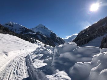 Snow covered mountains against sky