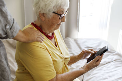 Senior woman using cell phone