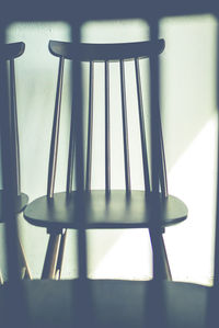 Close-up of empty chair on table at home