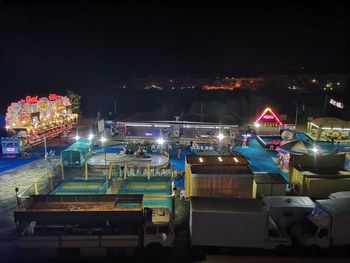 High angle view of illuminated boats moored at night