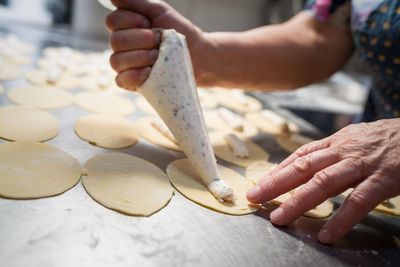 Close-up of person preparing food