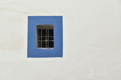 Window framed in blue