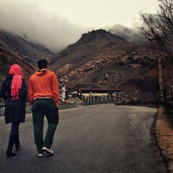 Man standing on mountain road