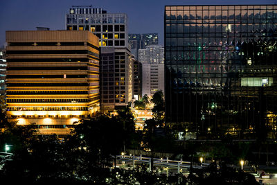 Illuminated buildings in city at night