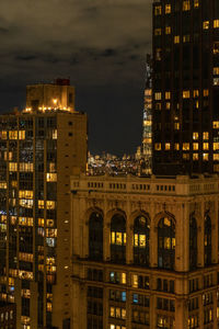 Illuminated buildings in city at night