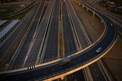 Long exposure movement cars on the interchange and motor way industrial transportation logistics 