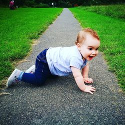 Toddler crawling in the park