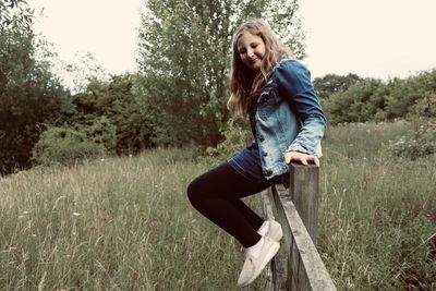 Portrait of beautiful young woman on land