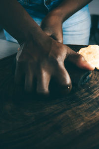 Midsection of man working on table