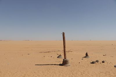 Scenic view of desert against clear sky