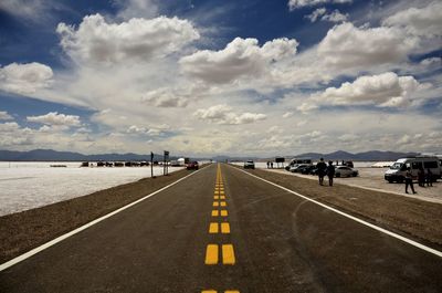 Road by sea against sky