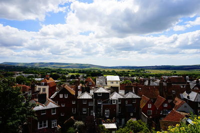 High angle shot of town against cloudy sky