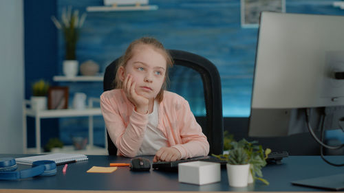 Cute girl looking at computer