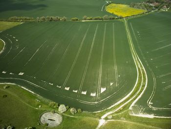 The longman of wilmington, sussex, uk. aerial photo of the surrounding farmland and dew pond.