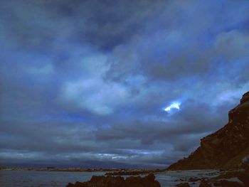 Scenic view of storm clouds over sea