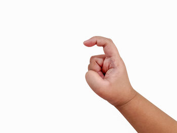 Close-up of human hand against white background