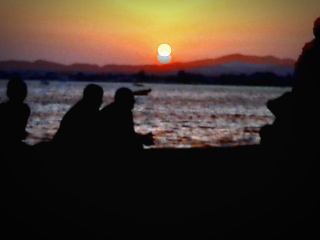 silhouette, sunset, beauty in nature, nature, scenics, real people, sun, two people, moon, outdoors, tranquil scene, sea, sky, leisure activity, tranquility, water, men, togetherness, mountain, clear sky, close-up, astronomy, people