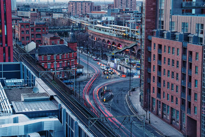 High angle view of traffic on road amidst buildings in city