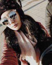 Portrait of young woman in sunglasses