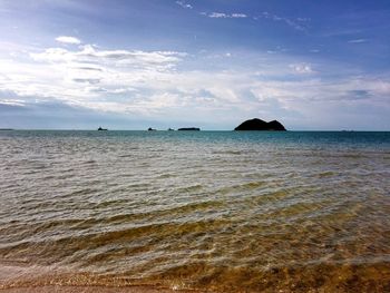 View of boats in calm blue sea