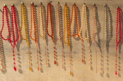 Close-up of multi colored decorations hanging on wall