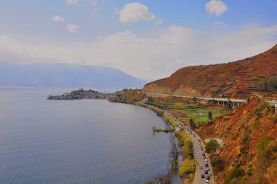 High angle view of road and mountain at riverbank