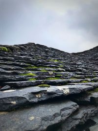 Low angle view of rocks against sky