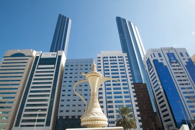 Low angle view of buildings against sky in city