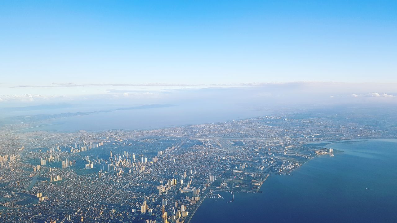 AERIAL VIEW OF CITYSCAPE AGAINST SKY