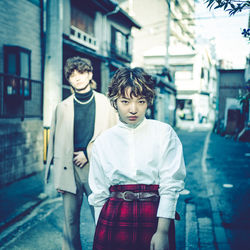 Portrait of boy standing in city