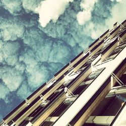 Low angle view of building against cloudy sky