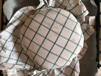 Low section of person standing on paper