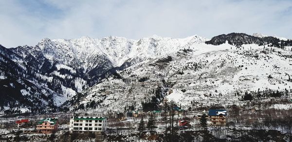 Scenic view of snowcapped mountains against sky