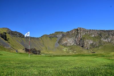 Scenic view of landscape against clear blue sky