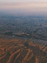 Aerial view of city during sunset