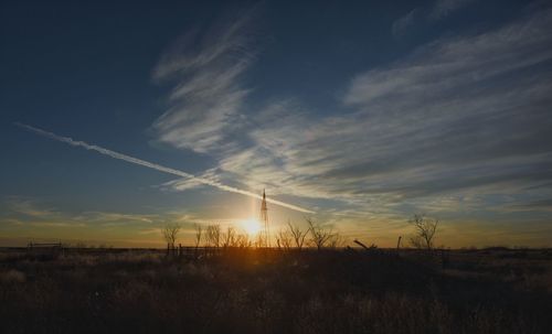 Scenic view of landscape against sky during sunset